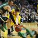 Michigan senior Stu Douglass scrambles after a loose ball with Ohio University junior Ivo Baltic during a time out in the second half of the second round of the NCAA tournament at Bridgestone Arena in Nashville, Tenn.  Melanie Maxwell I AnnArbor.com